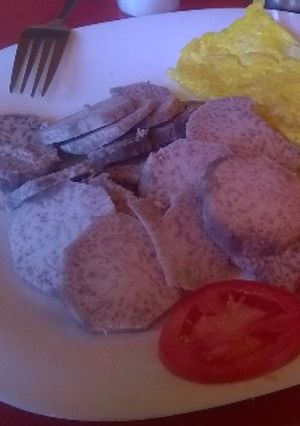 A picture of Arrowroots served with fried egg and tomatoes.