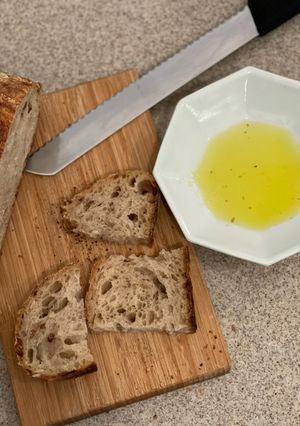 A picture of Olive Oil, Salt and Bread.