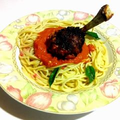 A picture of Frenched Drumstick with Spaghetti Hot sauce.