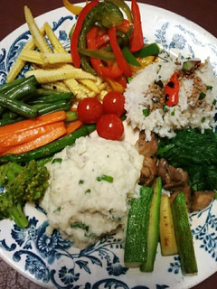 A picture of Stir fried vegetables and mashed potatoes.