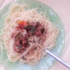A picture of Spaghetti and beef stew.