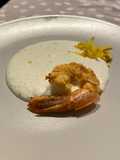 Crema di burrata al timo, zeste di limone e gamberone croccante all'arancia