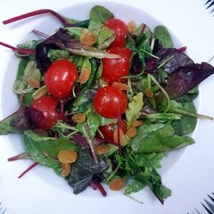 A picture of Spring mix salad with digon mustard dressing.