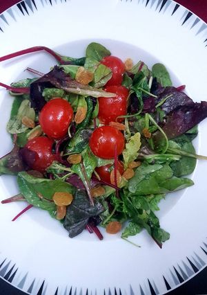 A picture of Spring mix salad with digon mustard dressing.