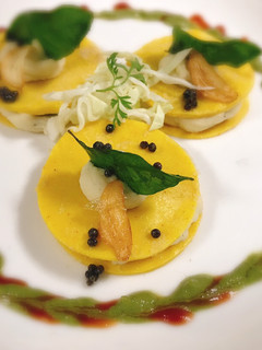 A picture of Crepe khandvi ravioli with mashed potatoes.
