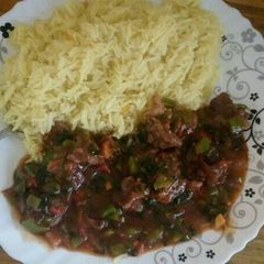 A picture of Beef served with stemed rice.