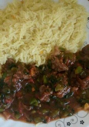 A picture of Beef served with stemed rice.