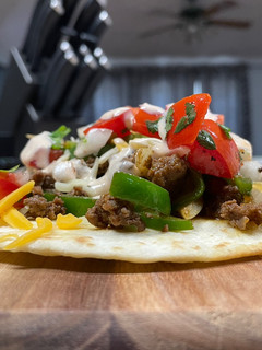 A picture of Beef & Cheese Tostada.