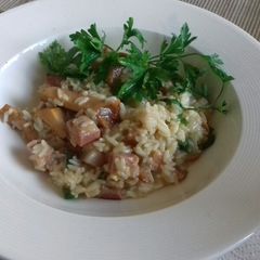 A picture of Risotto with pancetta and chanterelles.