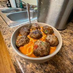A picture of Quick vodka sauce pasta with homemade meatballs.