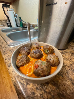 A picture of Quick vodka sauce pasta with homemade meatballs.