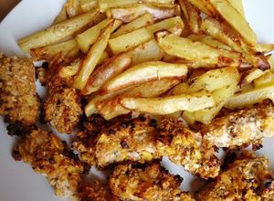 Foto principal de Pollo rebozado con copos de maíz y cebolla deshidratada