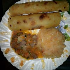 A picture of Carrot chapatis,steamed cabbage plus beef stew.