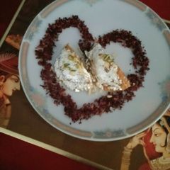 A picture of #carrot samolina sweet stuff with nuts&rose petal jam#dussehra.
