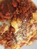 Polenta gratinada con tuco