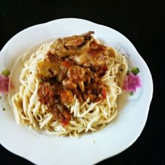 A picture of Spaghetti with stew.