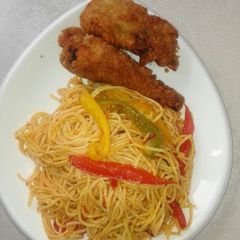A picture of Vegetabled, Jollof spaghetti and crispy fried chicken.