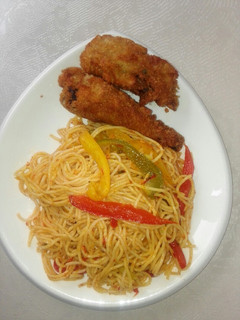 A picture of Vegetabled, Jollof spaghetti and crispy fried chicken.