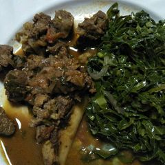 A picture of Stewed beef with greens.