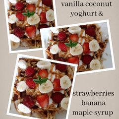 A picture of Waffles with vanilla coconut yoghurt & strawberries banana maple.