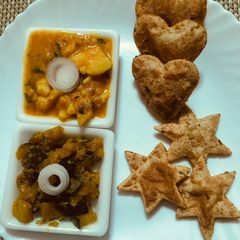 A picture of Aloo puri with Khata meetha petha sabzi.