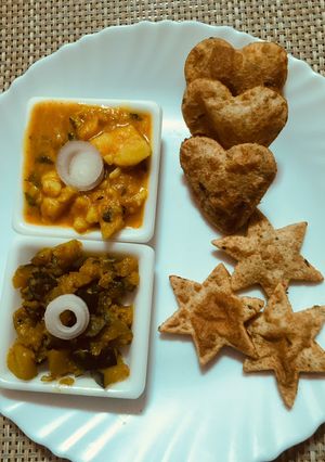 A picture of Aloo puri with Khata meetha petha sabzi.