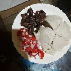 A picture of Ugali,goat meat fry and kachumbari.