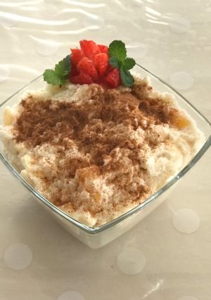 A picture of Poha curd with honey and fruits.