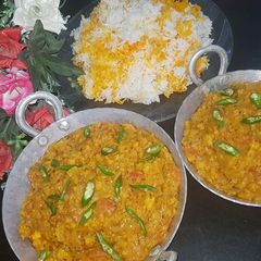 A picture of Dam allu with colourful zeera rice.