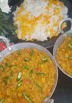 A picture of Dam allu with colourful zeera rice.