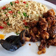 A picture of Coconut rice with sauced beef.