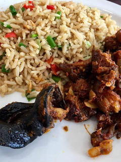 A picture of Coconut rice with sauced beef.