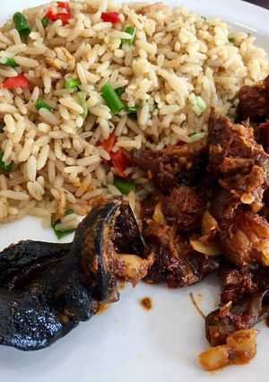 A picture of Coconut rice with sauced beef.