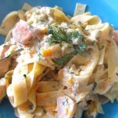 A picture of Salmon pasta with carrots and courgette.