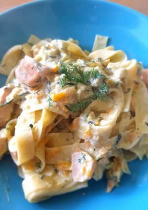 A picture of Salmon pasta with carrots and courgette.