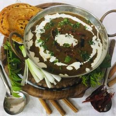 A picture of Dal Maharani With Mirchi Parantha.