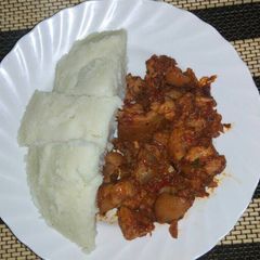A picture of Pork with Ugali.
