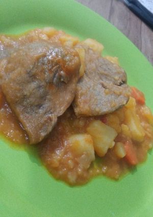 Una foto de Bife a la criolla