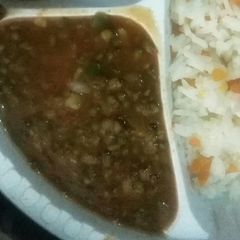 A picture of Stewed Green grams served with Rice.