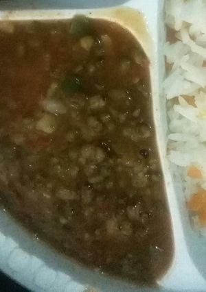 A picture of Stewed Green grams served with Rice.