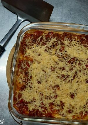 Una foto de Canelones de ricota y espinaca con salsa bologñesa