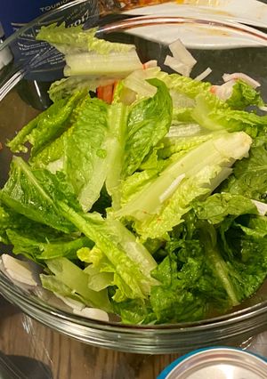 A picture of Romaine lettuce salad with crab stick and homemade dressing.