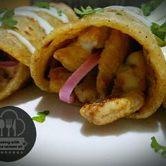 A picture of Chicken roll paratha with garlic mayo sauce.