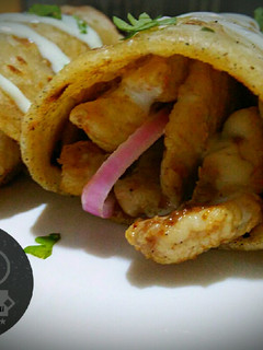 A picture of Chicken roll paratha with garlic mayo sauce.