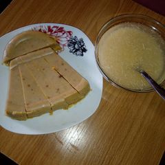 A picture of Palm oil Moi moi and Garri.
