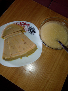 A picture of Palm oil Moi moi and Garri.