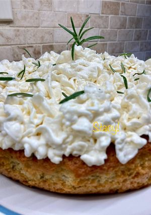 A picture of Lemon Rosemary Olive Oil Cake with Mascarpone Cream.