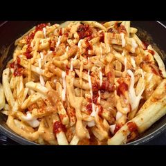 A picture of Saucy Steak Curry with Chips.
