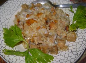 Una foto de Cerdo cocinado en tajine con leche de coco y arroz