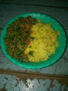 A picture of Turmeric rice and kachumbari.